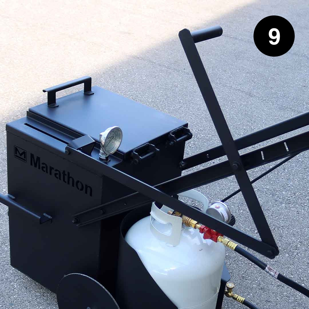 Black Marathon oil filter machine on a concrete surface