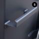 Metal bracket attached to kettle wall with a dark background